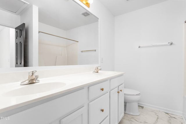 bathroom with vanity and toilet