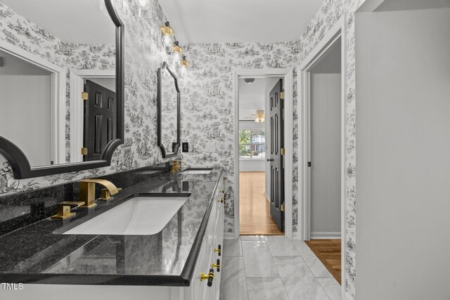 4619 Cross Ridge Ln, Greensboro, NC 27410 - bathroom featuring wallpapered walls, double vanity, and marble finish flooring