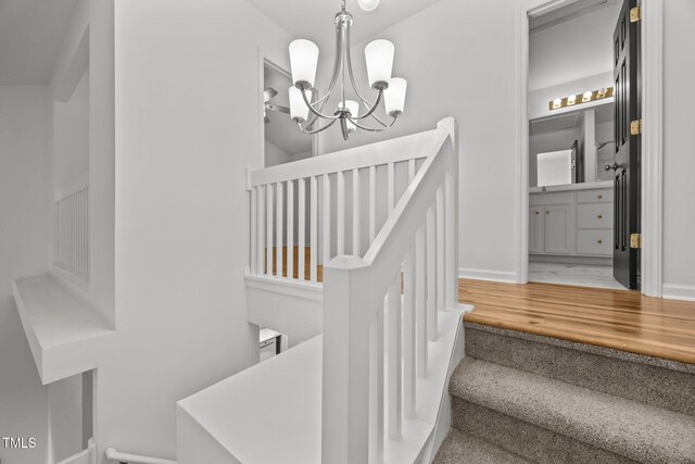 4619 Cross Ridge Ln, Greensboro, NC 27410 - stairs with a chandelier and wood finished floors