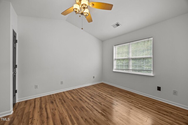 4619 Cross Ridge Ln, Greensboro, NC 27410 - unfurnished room with vaulted ceiling, wood finished floors, and ceiling fan