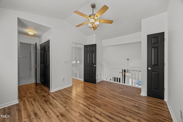 4619 Cross Ridge Ln, Greensboro, NC 27410 - spare room with ceiling fan, wood finished floors, a chandelier, and high vaulted ceiling