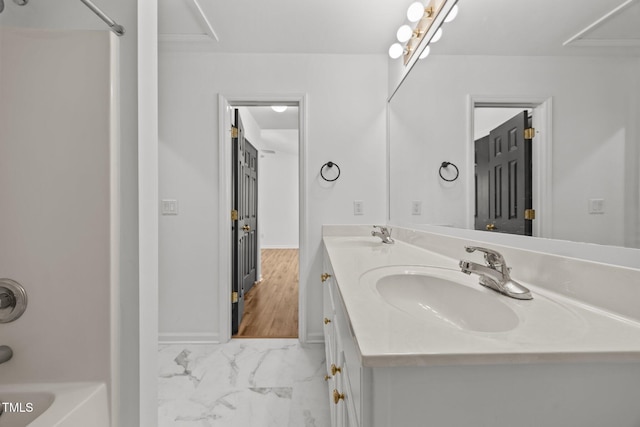 4619 Cross Ridge Ln, Greensboro, NC 27410 - full bath with double vanity, shower / tub combination, and marble look tile flooring