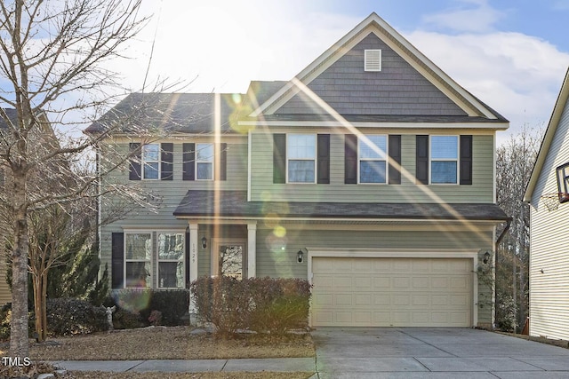 view of front of property with a garage