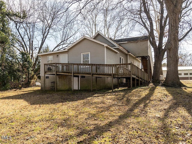 rear view of house featuring a deck