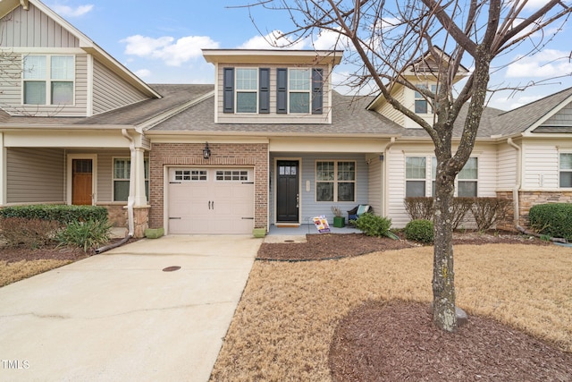 view of front of property featuring a porch and a garage