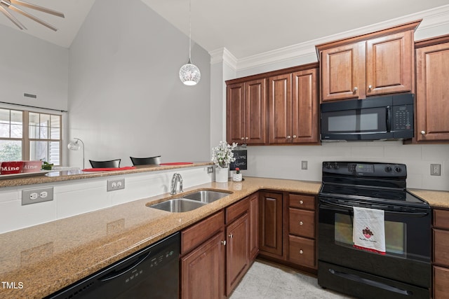 kitchen featuring sink, backsplash, light stone counters, and black appliances