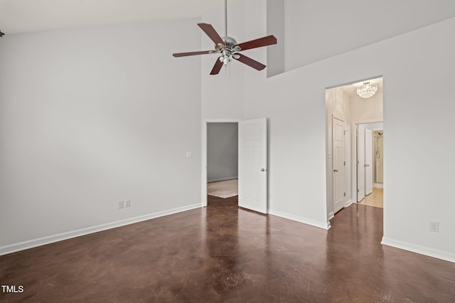 spare room with a high ceiling and ceiling fan