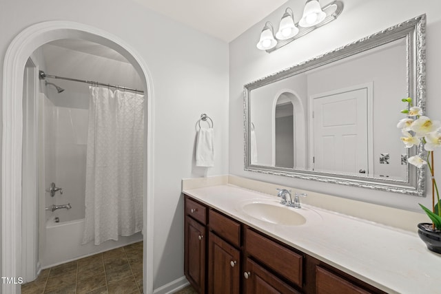 bathroom featuring vanity and shower / bath combination with curtain