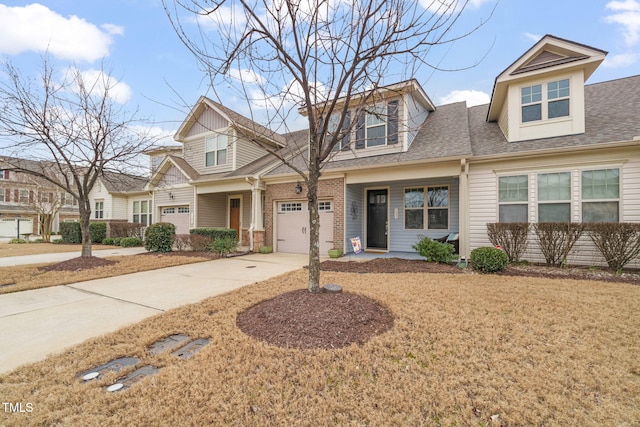 view of front of home featuring a garage and a front yard