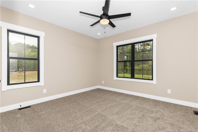 spare room with carpet, ceiling fan, baseboards, and recessed lighting