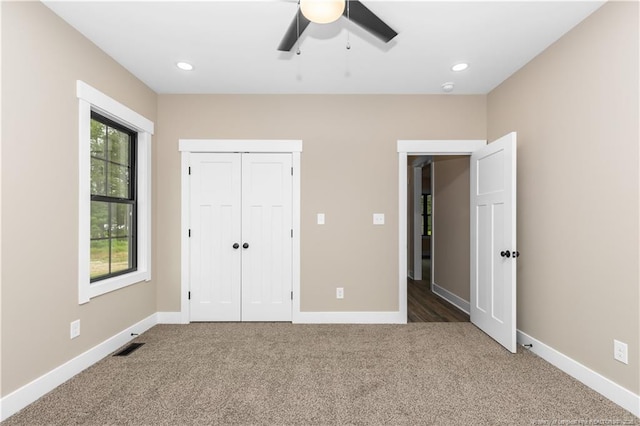 unfurnished bedroom with carpet flooring, baseboards, a closet, ceiling fan, and recessed lighting