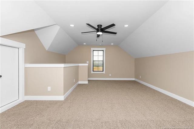 additional living space with carpet, a ceiling fan, baseboards, vaulted ceiling, and recessed lighting