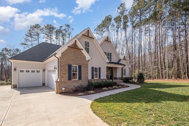 view of front of property with a garage and a front lawn