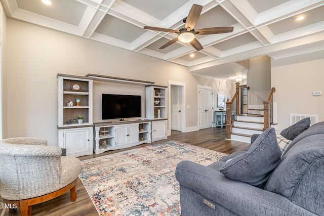 living room featuring dark wood-type flooring, coffered ceiling, and beamed ceiling