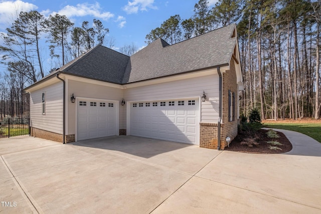 view of side of home with a garage