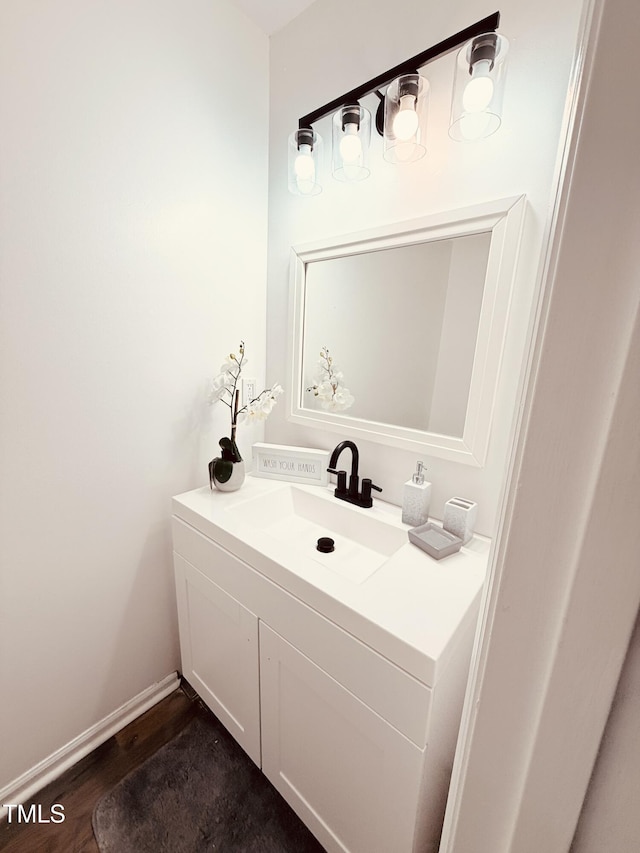 bathroom featuring vanity and wood-type flooring