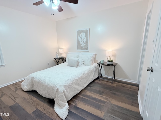 bedroom featuring ceiling fan and dark hardwood / wood-style flooring