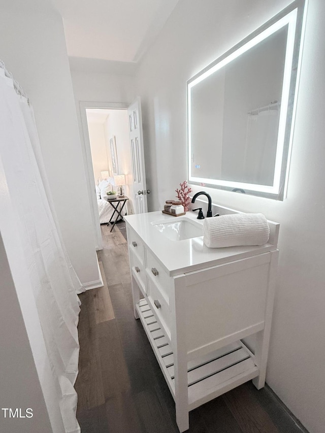 bathroom featuring vanity and hardwood / wood-style floors