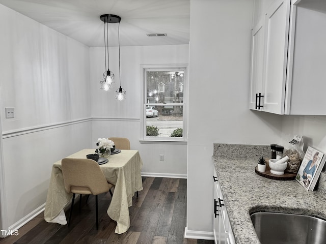 dining room featuring dark hardwood / wood-style floors