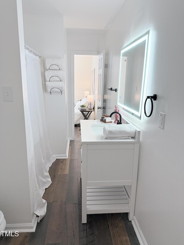 bathroom with vanity and hardwood / wood-style floors