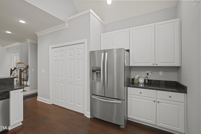 kitchen featuring ornamental molding, stainless steel appliances, dark hardwood / wood-style floors, and white cabinets