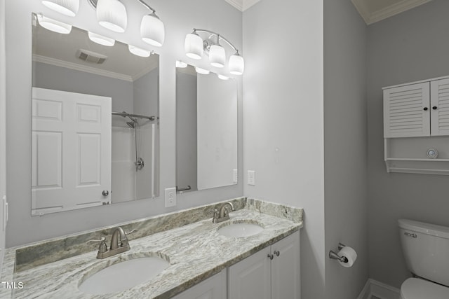 bathroom featuring vanity, ornamental molding, toilet, and walk in shower