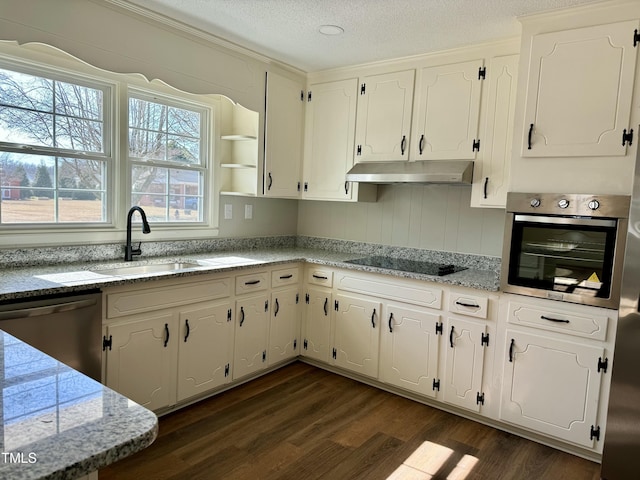 kitchen with a textured ceiling, dark wood-type flooring, stainless steel appliances, and white cabinets