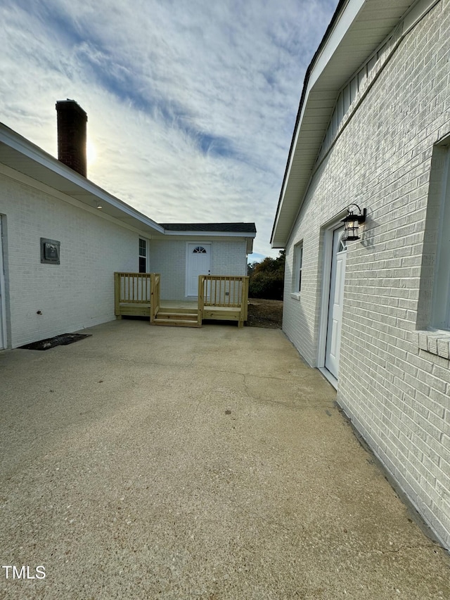 view of side of home featuring a deck