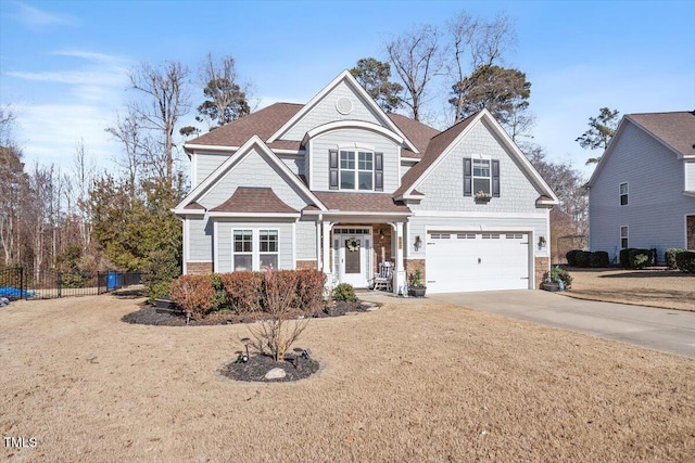 view of front facade with a garage and a front lawn