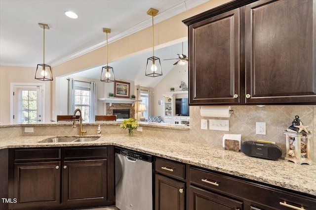 kitchen with stainless steel dishwasher, dark brown cabinetry, decorative light fixtures, and sink