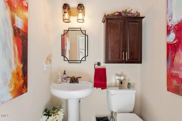 bathroom with sink and toilet