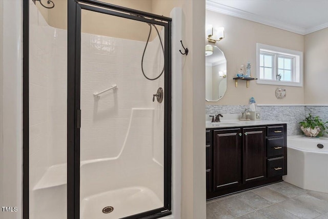 bathroom with ornamental molding, independent shower and bath, and vanity