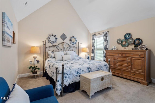 carpeted bedroom featuring high vaulted ceiling