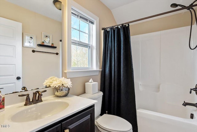 full bathroom featuring toilet, vanity, and shower / bathtub combination with curtain