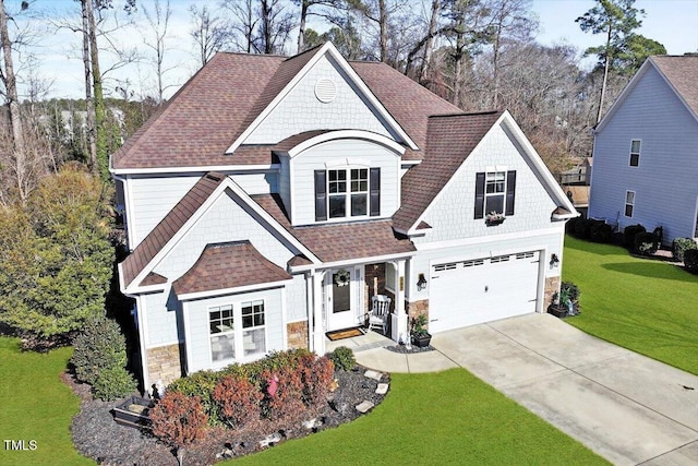 view of front of house featuring a garage and a front yard