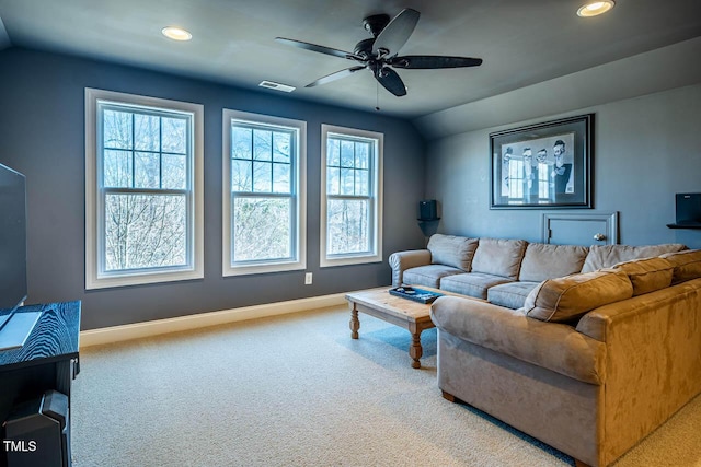 living room featuring lofted ceiling, light colored carpet, and ceiling fan