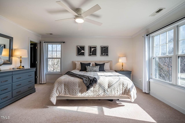 bedroom with ornamental molding, light carpet, and ceiling fan