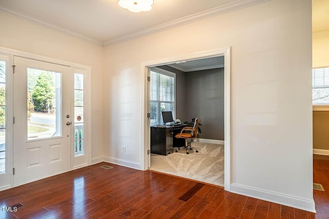 interior space featuring dark wood-type flooring and crown molding