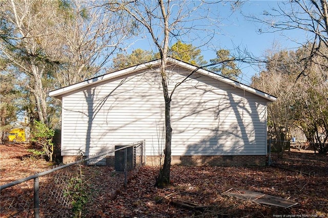 view of property exterior with central AC