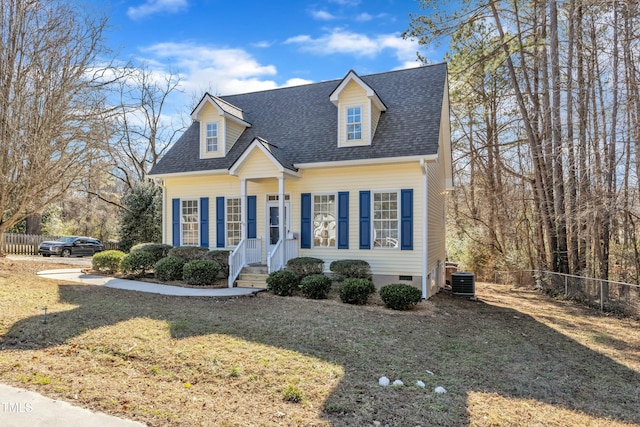 new england style home with central AC unit and a front lawn