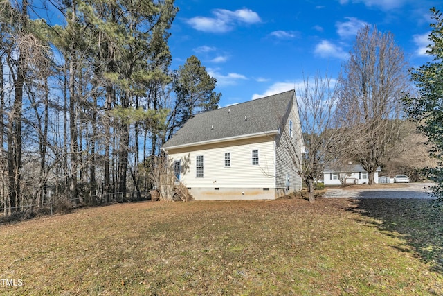 back of house with a lawn