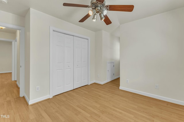 unfurnished bedroom featuring a closet, ceiling fan, and light hardwood / wood-style flooring