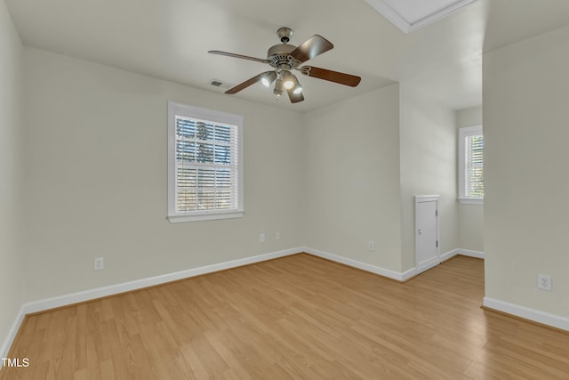 spare room featuring ceiling fan and light wood-type flooring