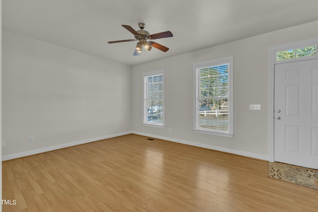 foyer entrance featuring light hardwood / wood-style floors and ceiling fan