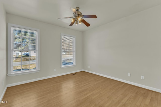 unfurnished room with ceiling fan and light hardwood / wood-style floors