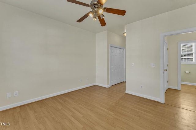 unfurnished bedroom featuring ceiling fan and light hardwood / wood-style flooring