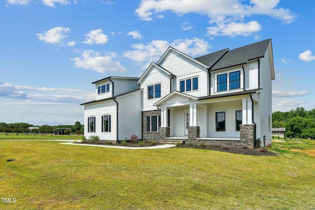 view of front of house featuring a front lawn and a porch