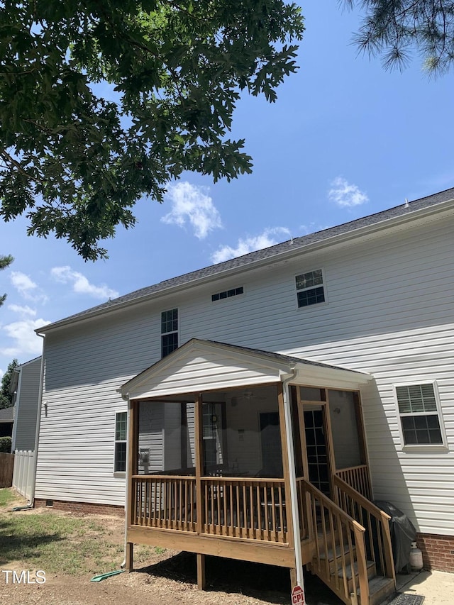 back of property featuring a sunroom