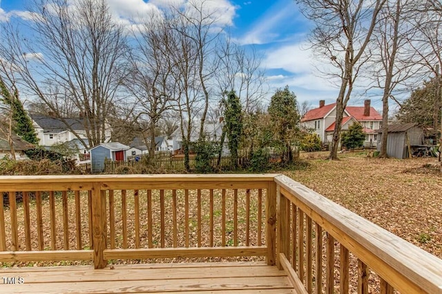 deck with a storage shed