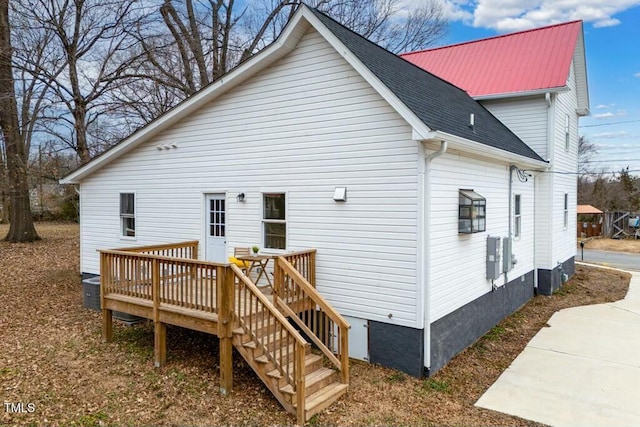 back of house with a wooden deck